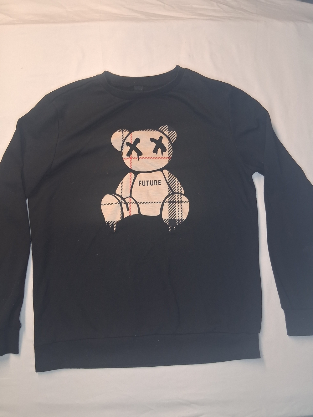 Black Crewneck Sweater with Beige Plaid Teddy Graphic